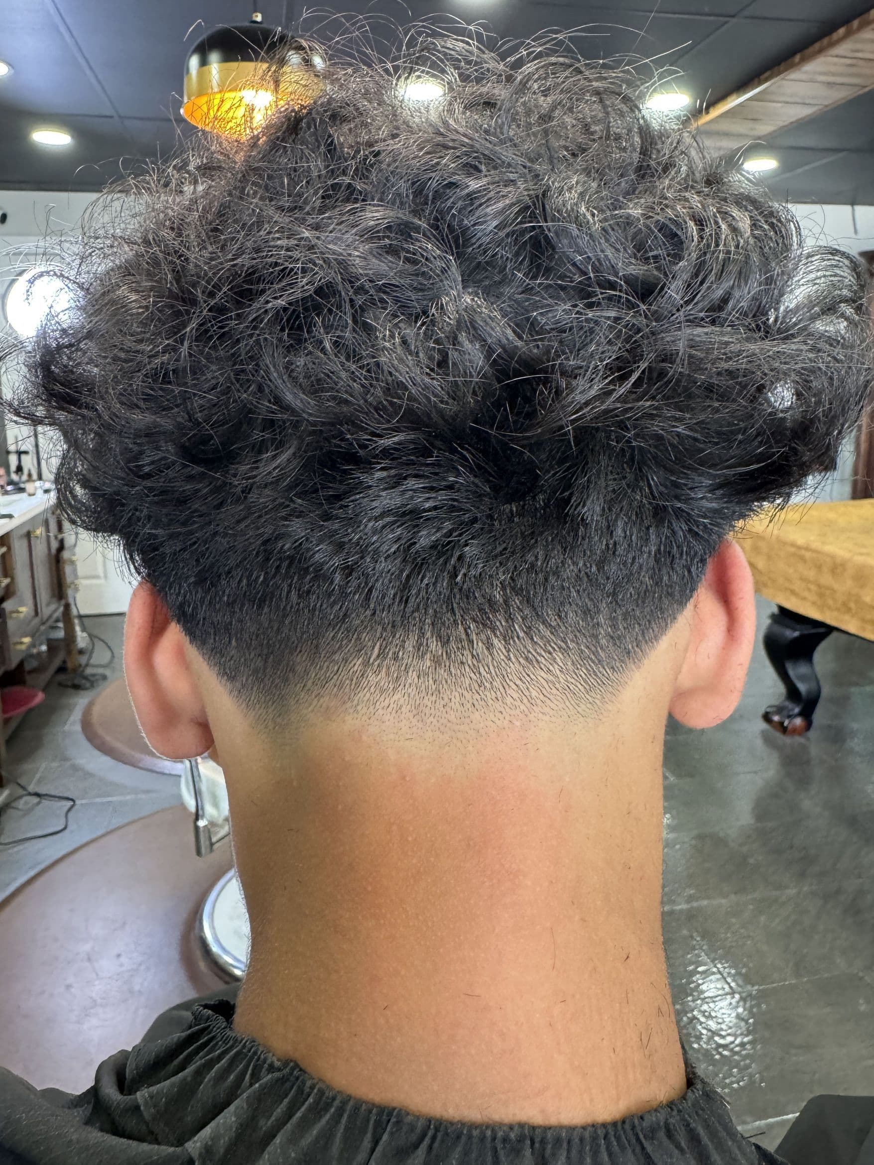 Low taper with natural curls from Casper's portfolio